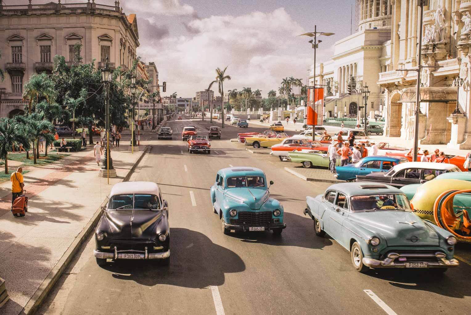 Old cars in Cuba. Epic Adventure Bucket List Ideas For Every Month of The Year